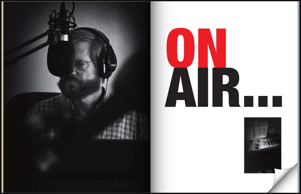 Rick Morris wearing headphones at a radio studio microphone